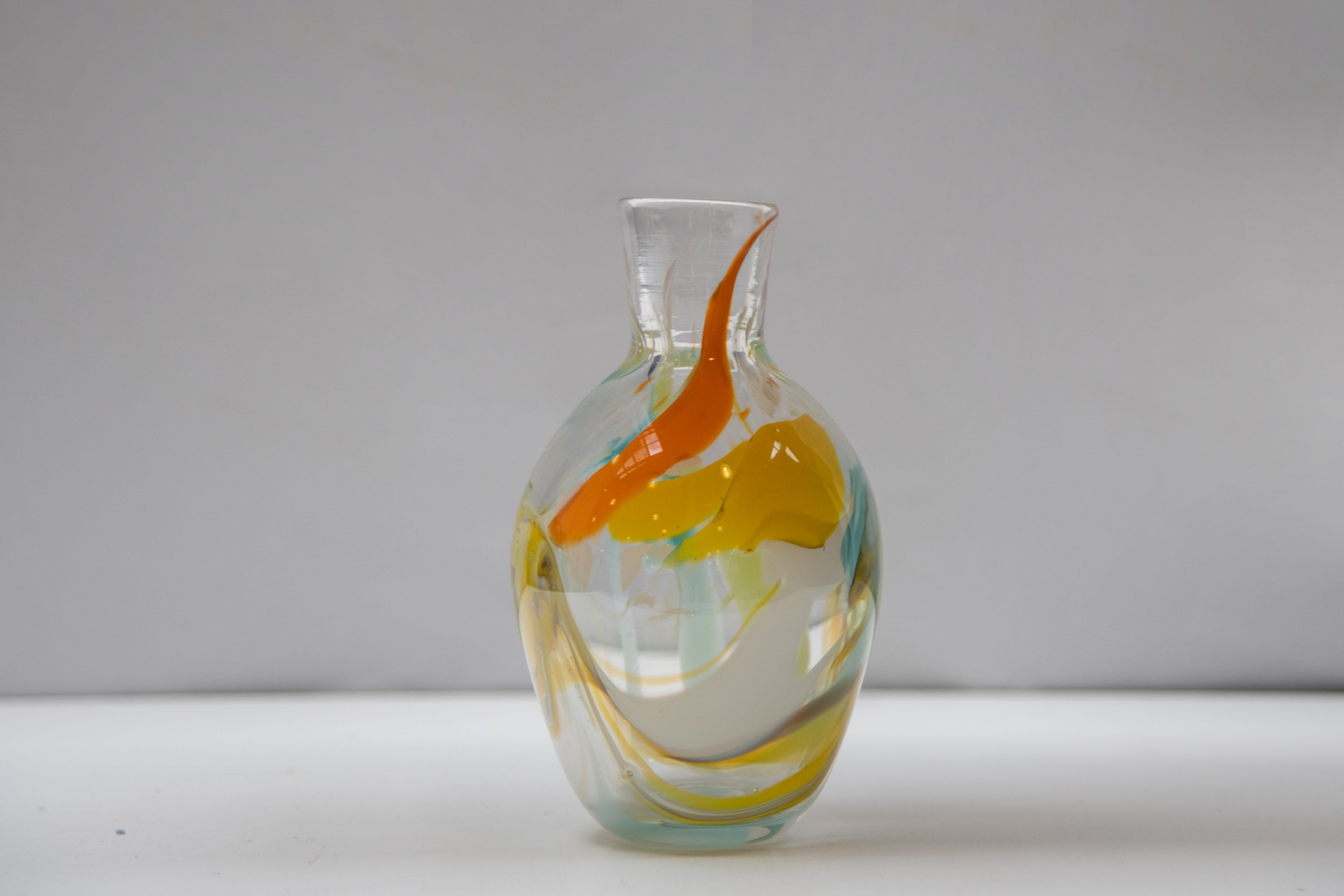 Clear vase with yellow and orange
