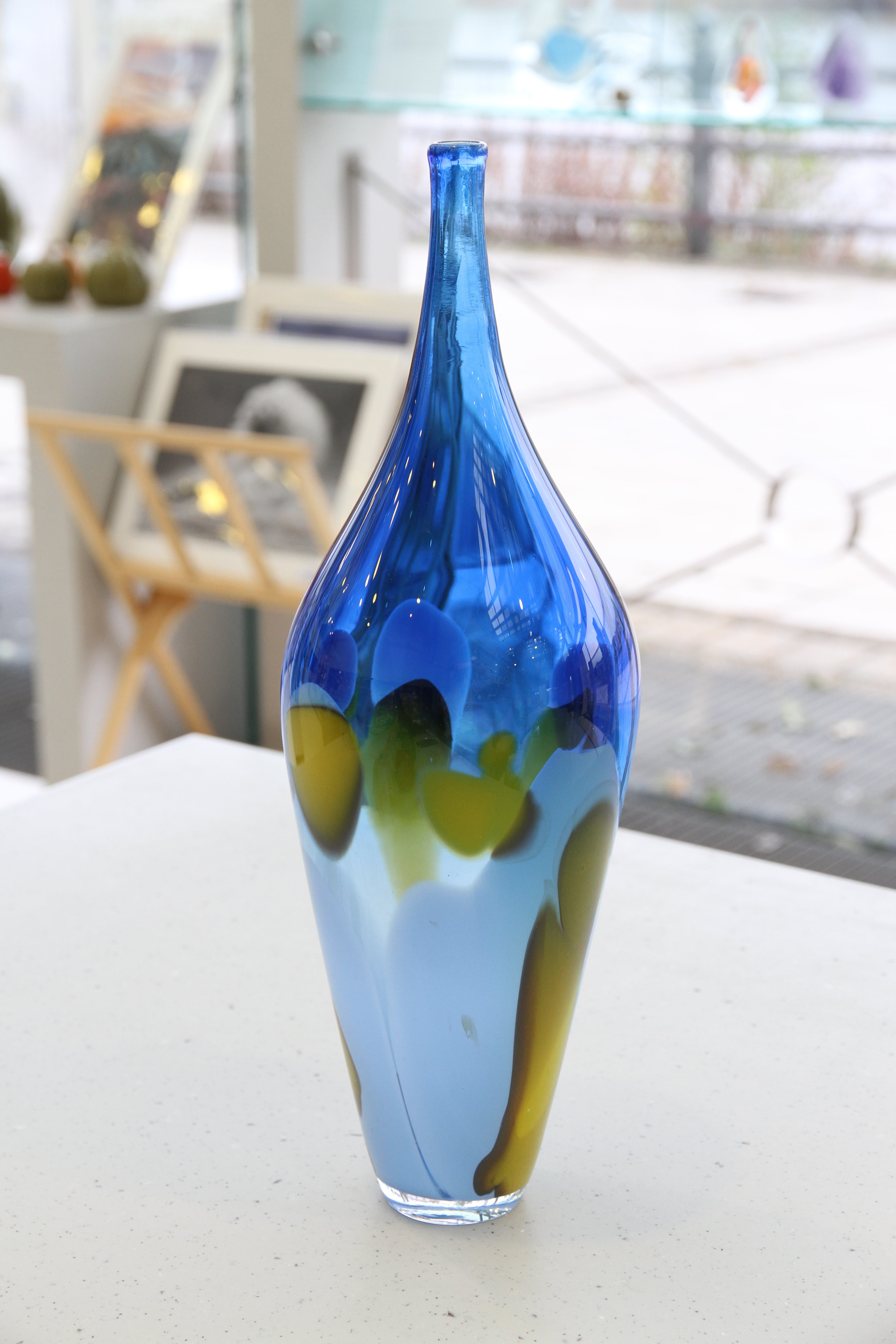 Blue ombre vase with yellow, brown and purple detail