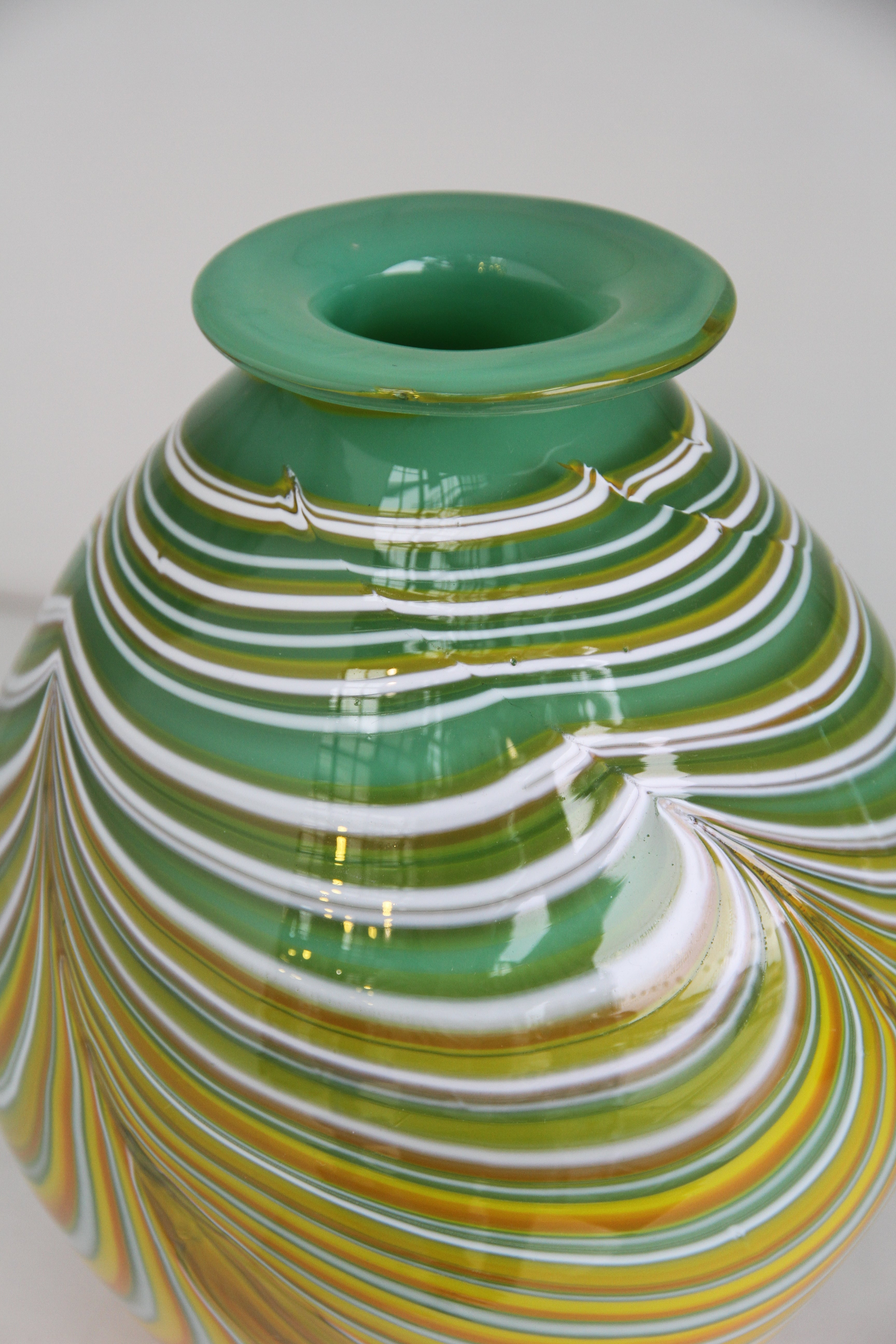 Green Vase with White, yellow and orange swirls