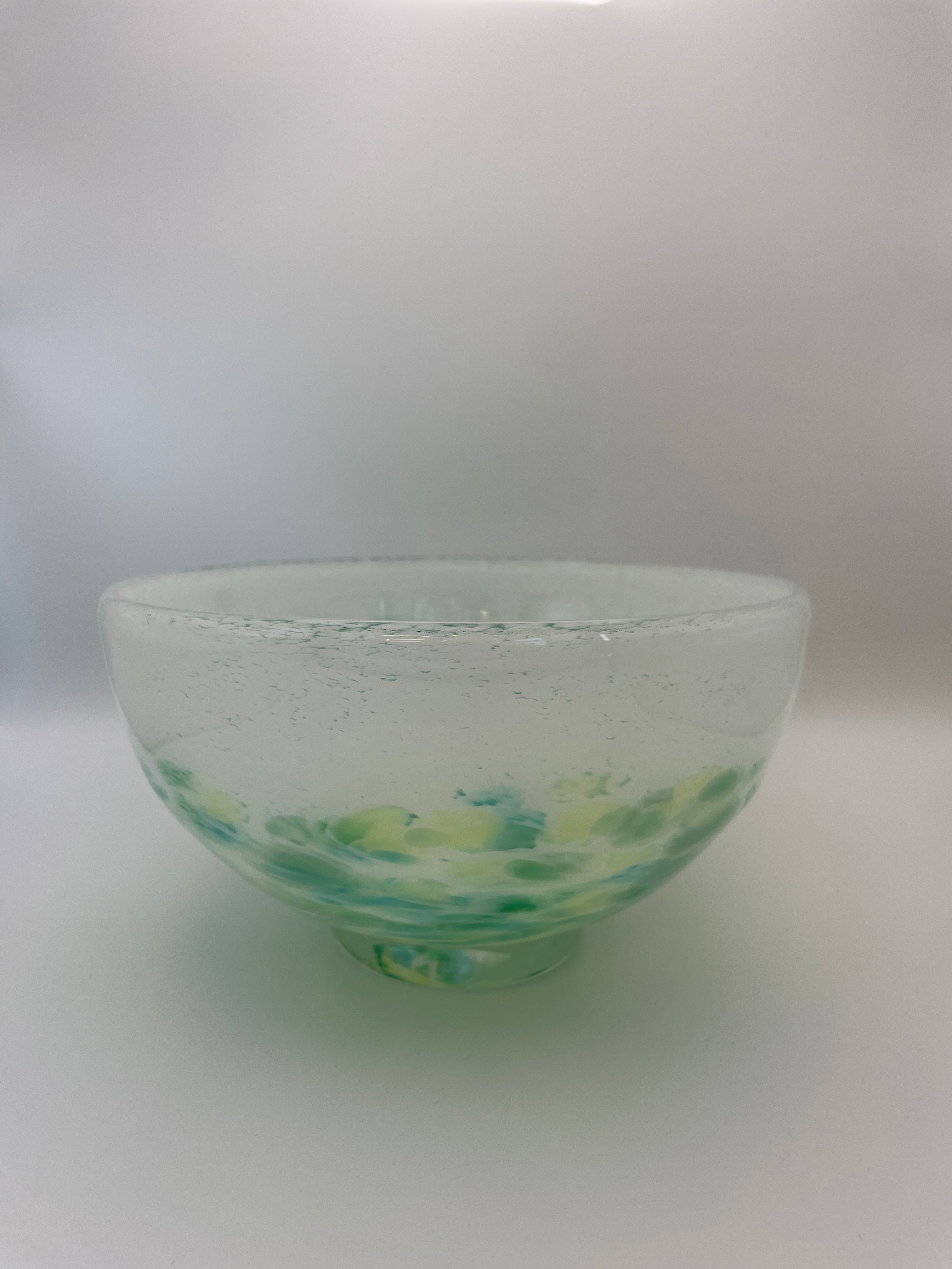 White bowl with green dots