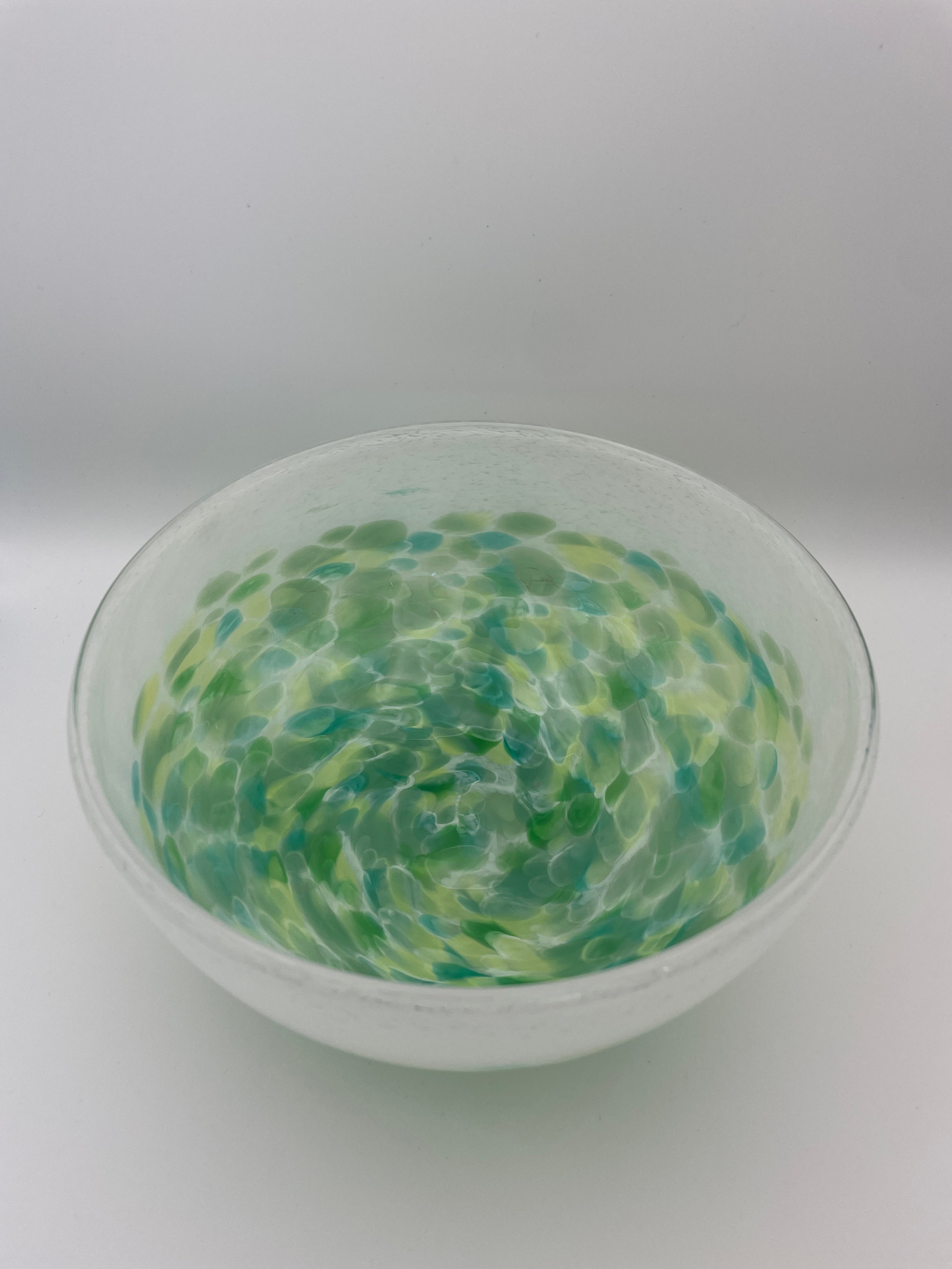 White bowl with green dots