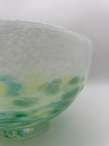 White bowl with green dots